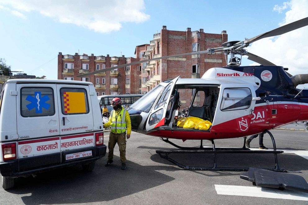 PHOTO: A helicopter carrying the body of famed U.S. extreme skier, Hilaree Nelson, lands at a hospital in Kathmandu, Nepal, Sept. 28, 2022. Nelson, 49, was skiing down from the summit of Mount Manaslu when she fell off the mountain.