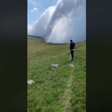 A hiker captured the cloud rolling across a hill in England.