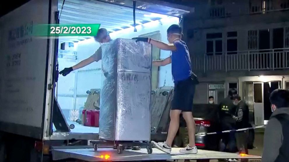 PHOTO: Police load the refrigerator that is suspected of having been used to keep body parts of 28-year-old model Abby Choi, onto a truck in Hong Kong, Feb. 25, 2023 in this screen grab taken from a handout video.