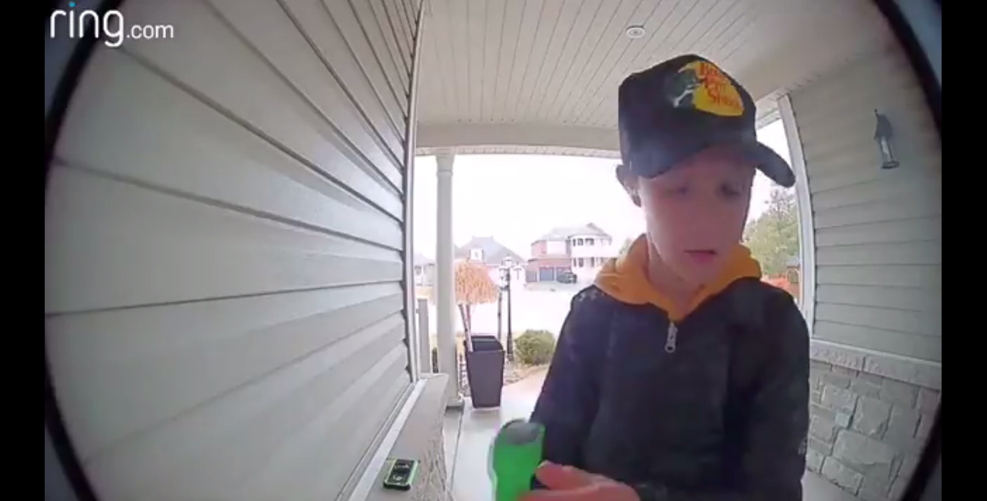 PHOTO: A video shared on Twitter on April 11, 2018 shows a young boy examining and then kissing a hockey stick left in tribute to those who died in the Humboldt Broncos bus crash earlier in the month.