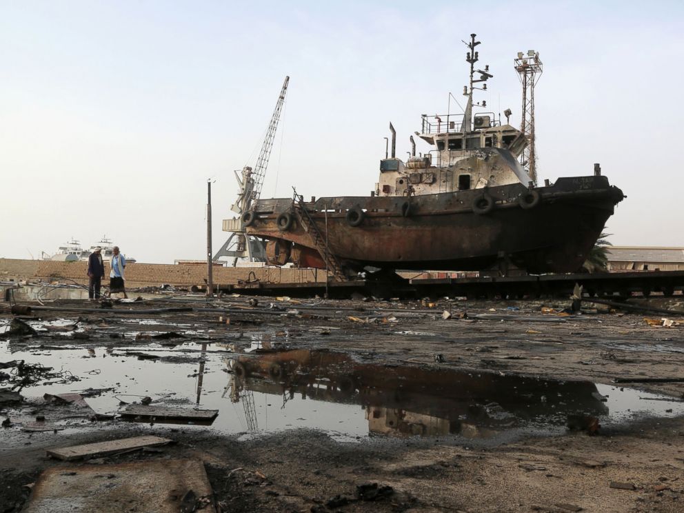 PHOTO: Workers inspect damages at the site of an air strike on the maintenance hub at the Hodeidah port, May 27, 2018.