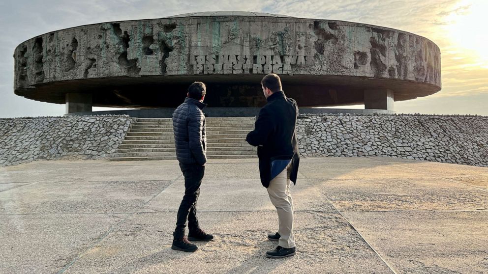 PHOTO: Lukasz Myszala, an archivist for the State Museum at Majdanek, shows ABC News’ Phil Lipof the inscription engraved at the front of the mausoleum where prisoners' ashes are kept.