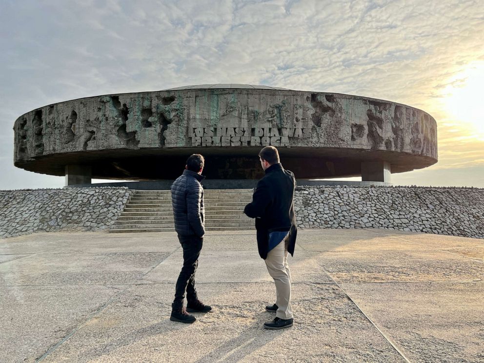 PHOTO: Lukasz Myszala, an archivist for the State Museum at Majdanek, shows ABC News’ Phil Lipof the inscription engraved at the front of the mausoleum where prisoners' ashes are kept.