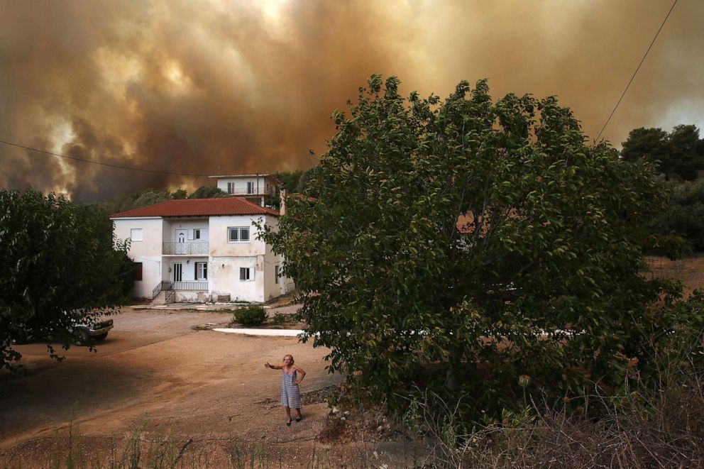 PHOTO: A woman speaks to a reporter as during a wildfire in Viliza village in the area of Ancient Olympia, Peloponnese, Greece, Aug. 5, 2021.