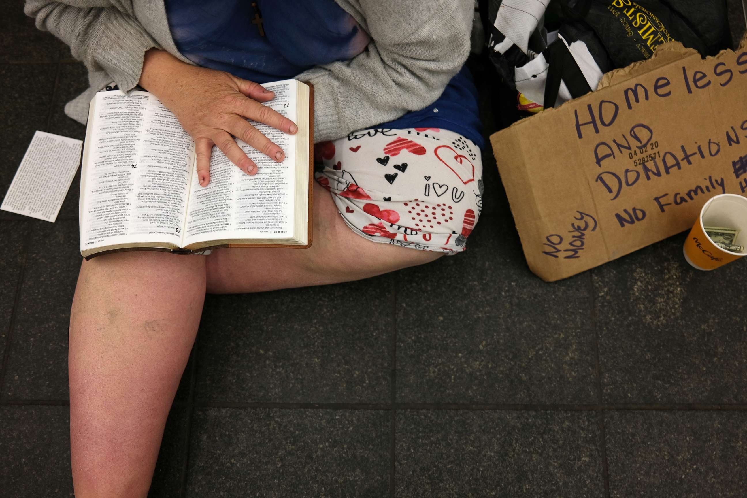 PHOTO: A homeless woman sits in a subway tunnel during the coronavirus outbreak, April 13, 2020, in New York City.