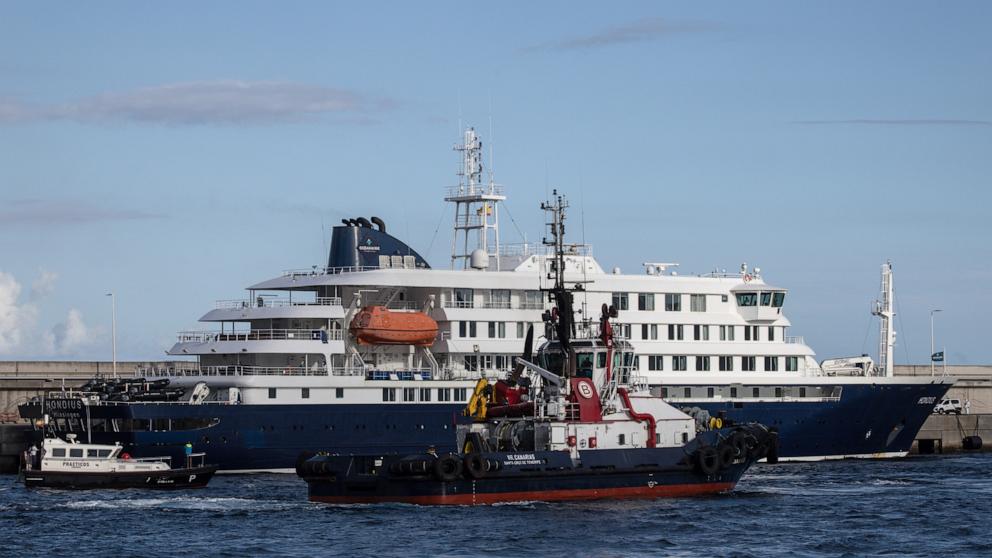 PHOTO: Port vessels accompany the MV Hondius as it departs the Granadilla Port after all passengers were evacuated on May 11, 2026 in Tenerife, part of the Canary Islands, Spain.