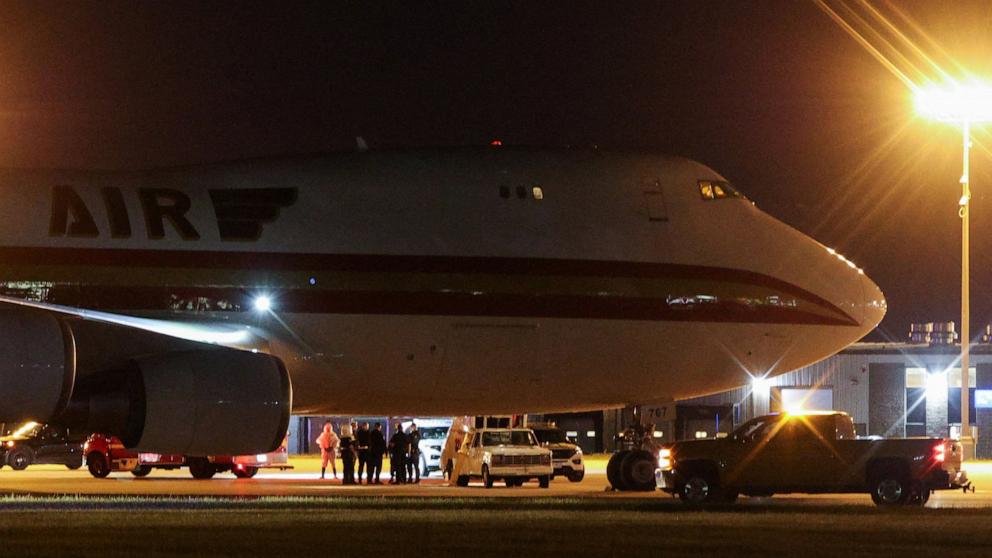 PHOTO: Personnel assist passengers evacuated from the cruise ship MV Hondius, which was affected by a hantavirus outbreak, and arrived on a chartered aircraft at Eppley Airfield in Omaha, Nebraska, May 11, 2026.