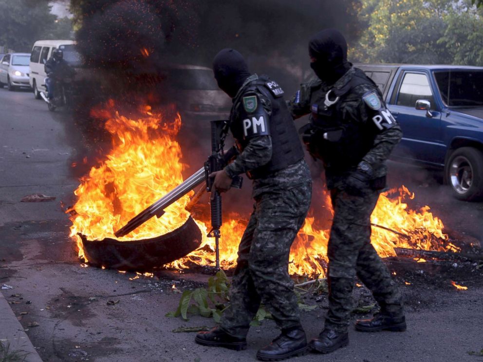 PHOTO: Military police clear a barricade set up by protestors supporting opposition presidential candidate Salvador Nasralla, in the outskirts of Tegucigalpa, Honduras, Dec. 22, 2017.