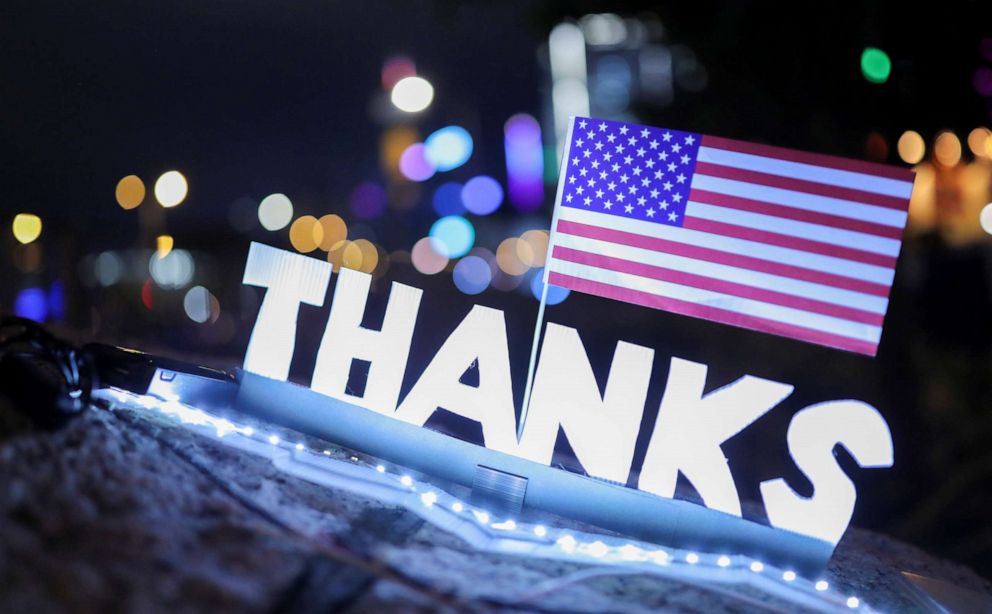 PHOTO:A sign reading "Thanks" with a U.S. flag above is seen during a gathering in Hong Kong, Nov. 28, 2019. 