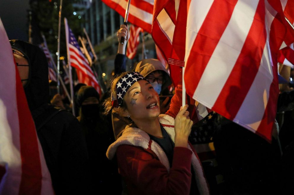 PHOTO: Protester holds a U.S. flag as she attends a rally in Hong Kong, China, Nov. 28, 2019. 