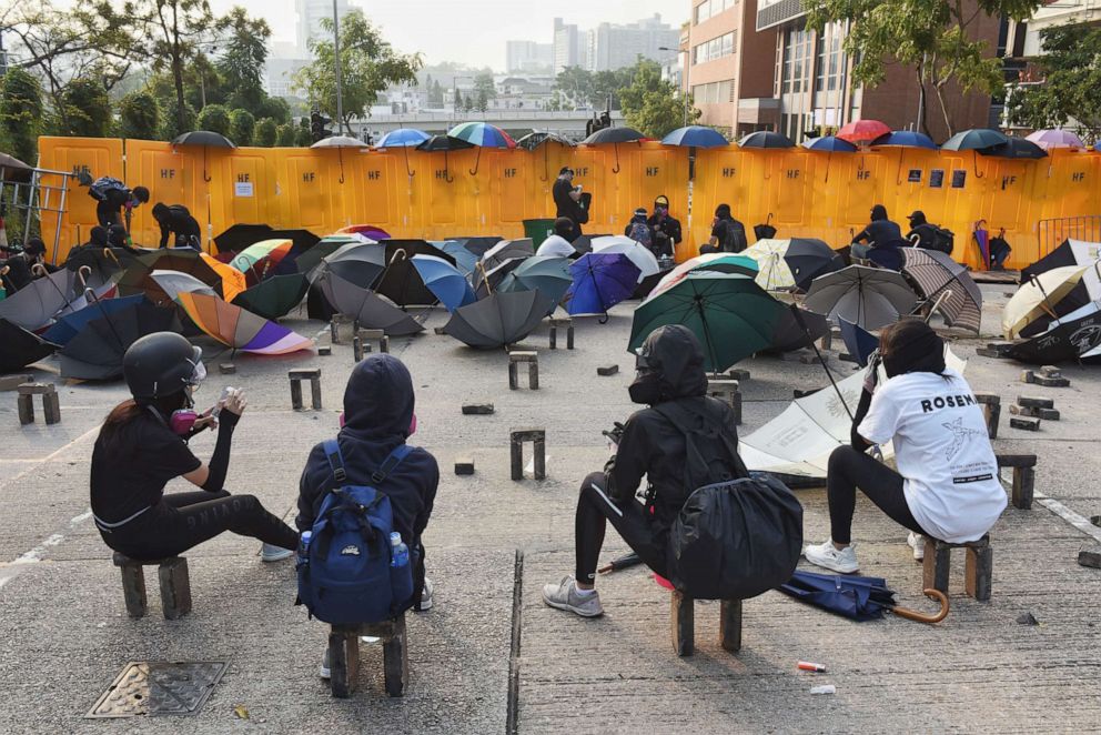 PHOTO: Demonstrators stand next to barricades during a protest at Hong Kong Baptist University in Kowloon Tong area, in Hong Kong, Nov. 13, 2019. 