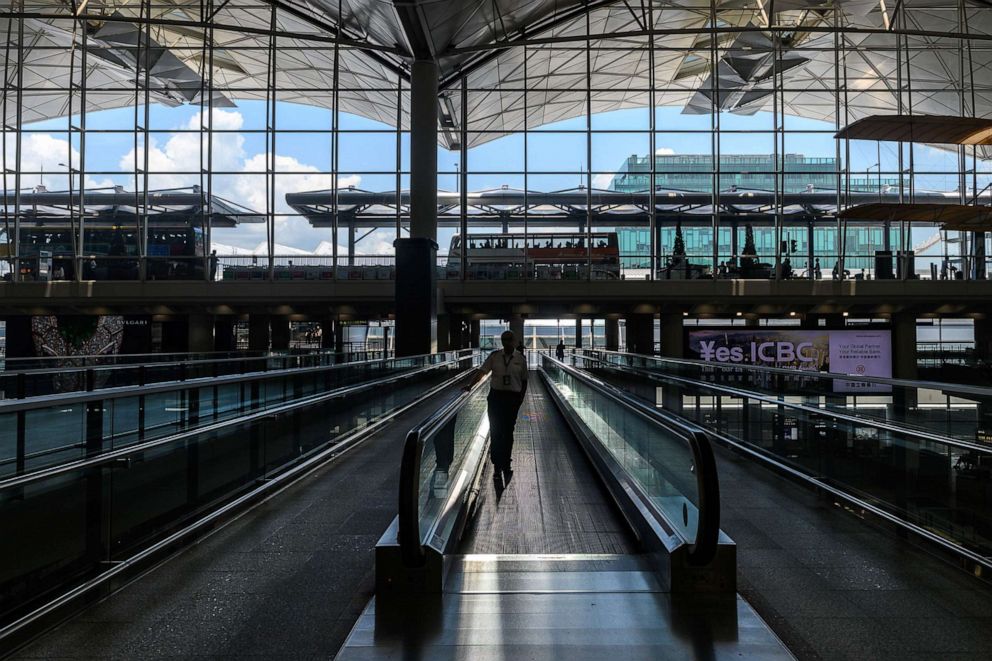 PHOTO: A security person stands on an escalator at Hong Kong international airport, Aug. 5, 2019, as continued protests interrupted normal air traffic.