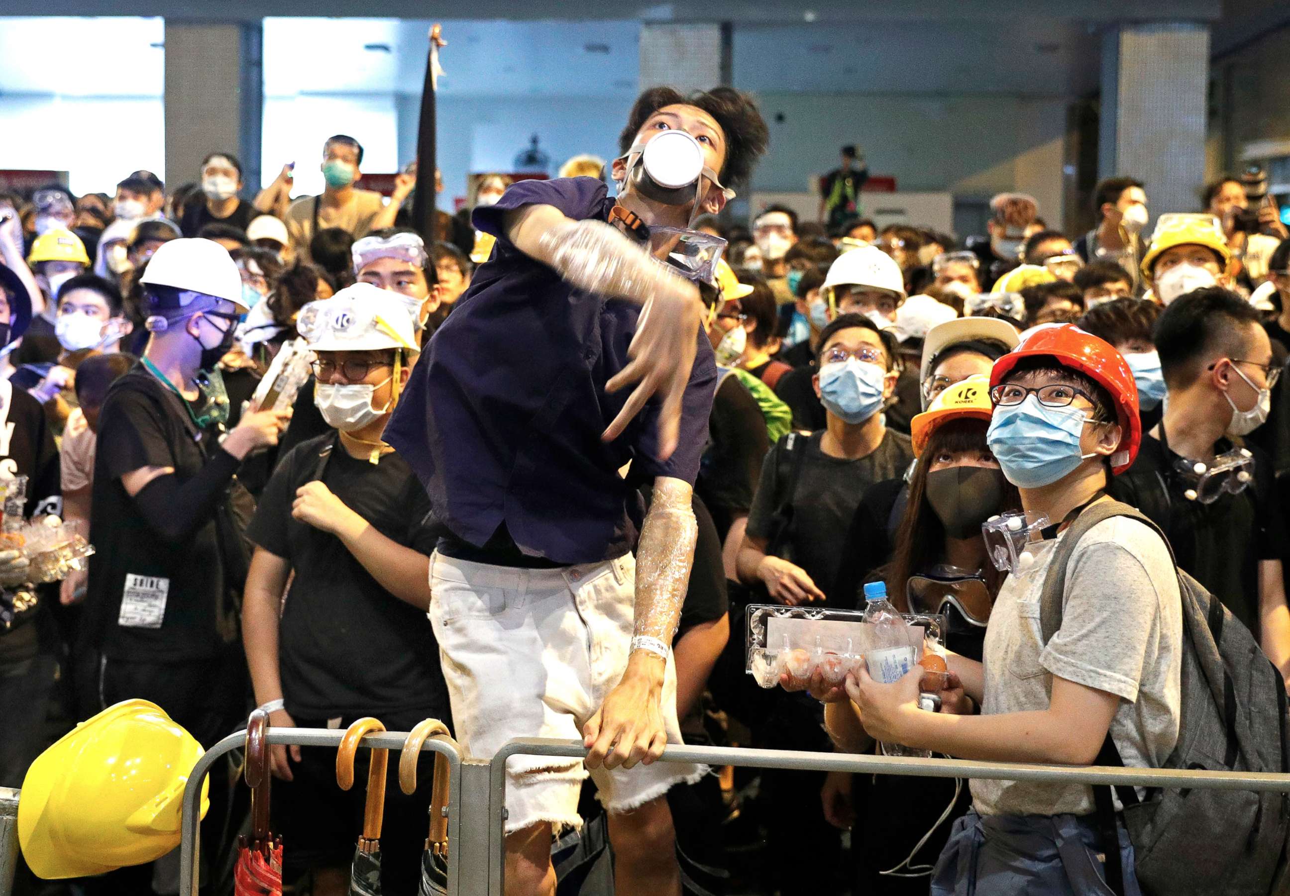 PHOTO:A protester throws eggs to police headquarters in Hong Kong, June 21, 2019.