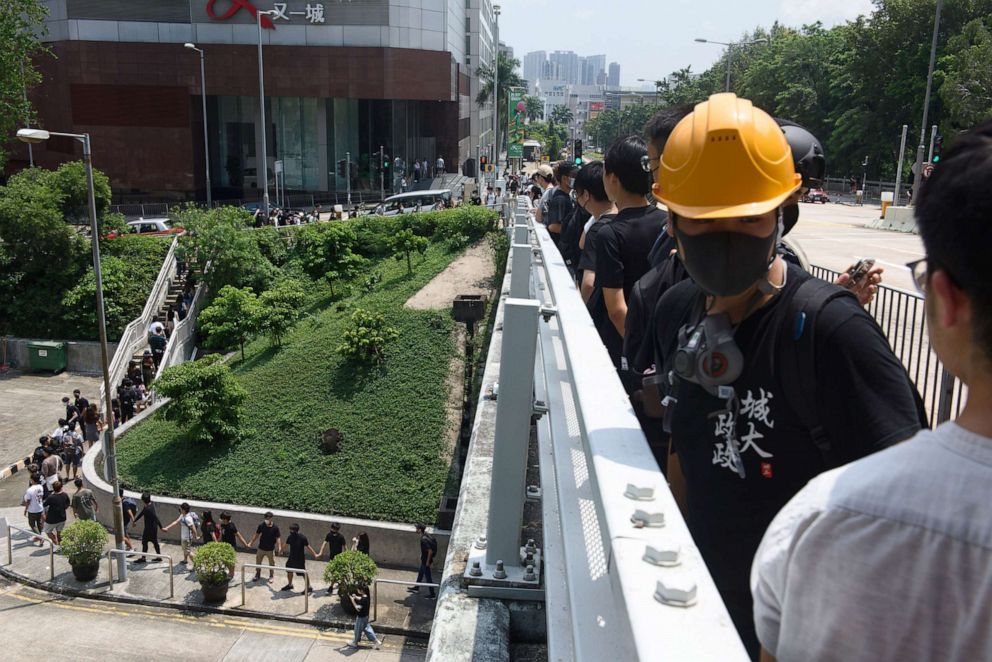 PHOTO: Students from City University and Baptist University form a human chain in Hong Kong, Sept. 9, 2019. Students from both universities linked up to urge the government to accept all five demands of anti-extradition bill campaigners.