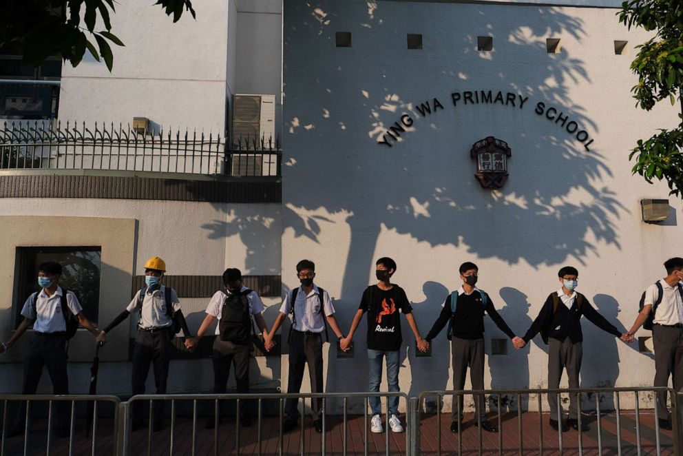 PHOTO: Secondary school students form a human chain in Hong Kong, Sept 9, 2019, in support of anti-government protesters.