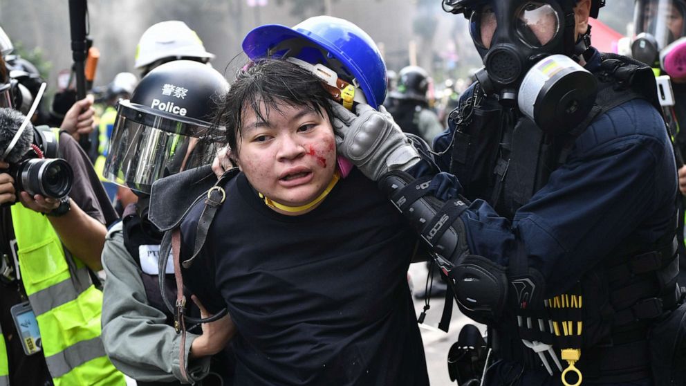 PHOTO: Protesters are detained by police near the Hong Kong Polytechnic University in Hung Hom district of Hong Kong on Nov. 18, 2019.
