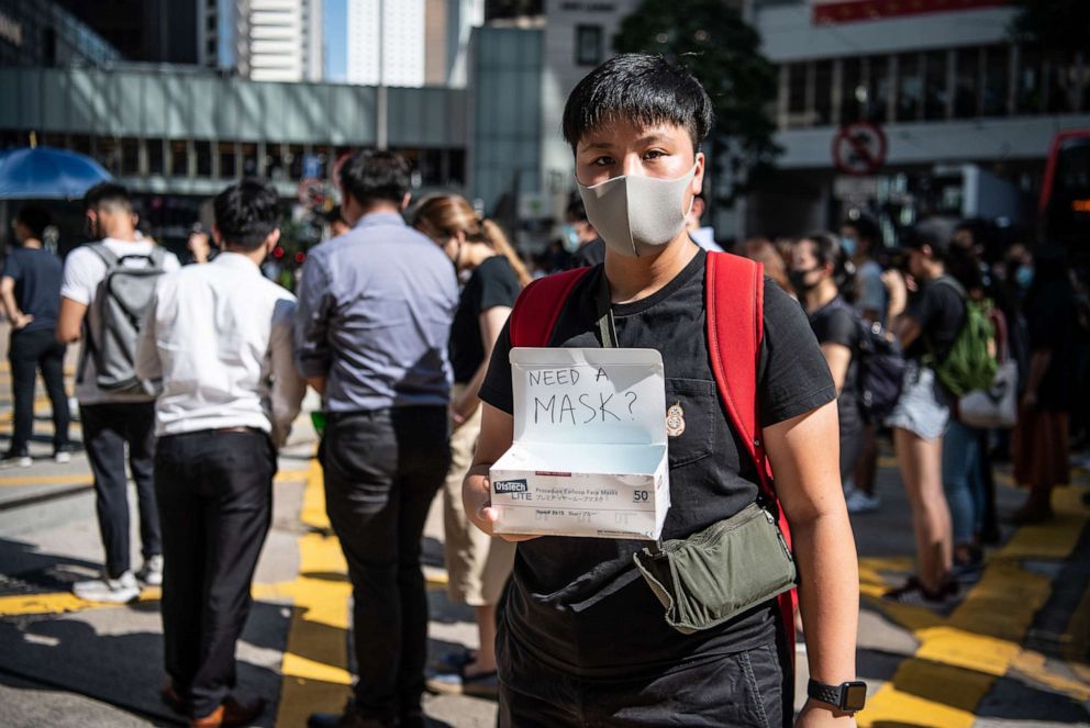 PHOTO: A woman offers masks during a protest against a government ban on face masks, Oct. 4, 2019 in Hong Kong, China.