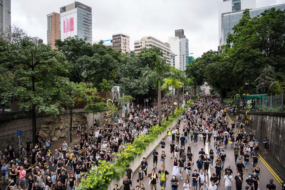 PHOTO: Protesters march towards the West Kowloon railway station during a protest against the proposed extradition bill on July 7, 2019, in Hong Kong, China.