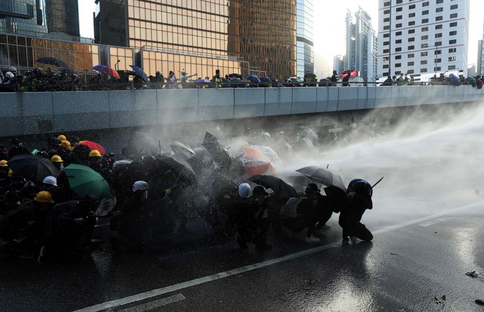 PHOTO: Anti-government protesters brave tear gas and water cannon to demonstrate outside the government headquarters complex in Hong Kong Sunday Sep 15, 2019.