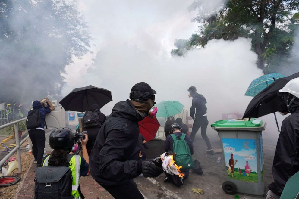 PHOTO: Student protesters battle against the riot police deployed at the campus gate in the Chinese University of Hong Kong, with homemade weapons including umbrellas and petrol bombs, Nov. 12, 2019.