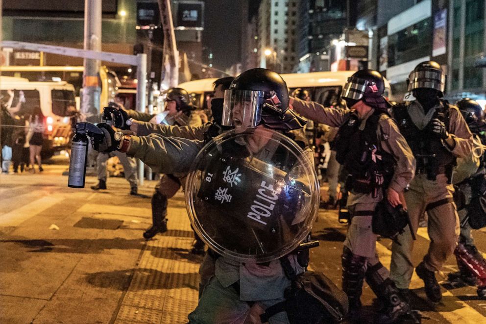 PHOTO: Riot police uses pepper spray in Mongkok district against protesters, Oct. 13, 2019 in Hong Kong.