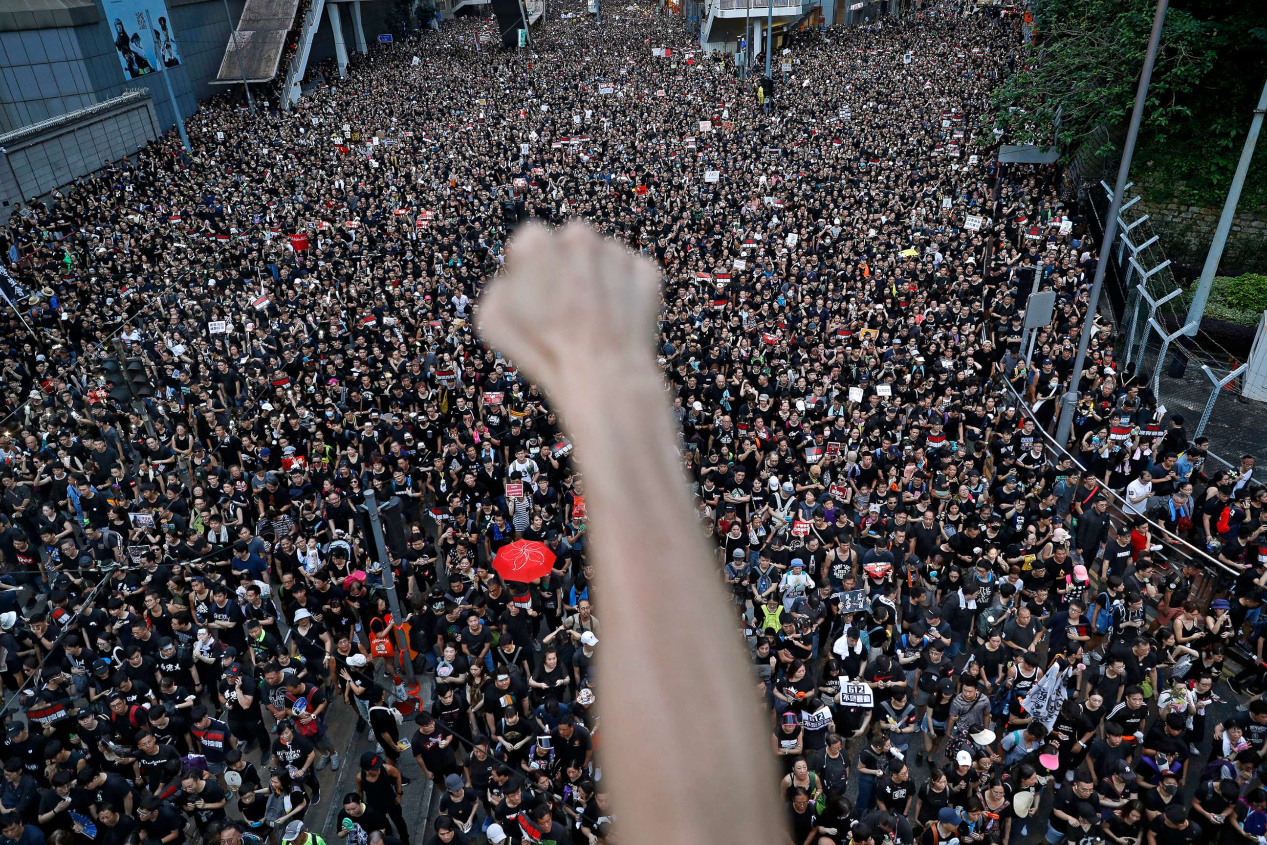 PHOTO: Demonstrators in Hong Kong march on the streets, June 16, 2019, to protest an extradition bill.