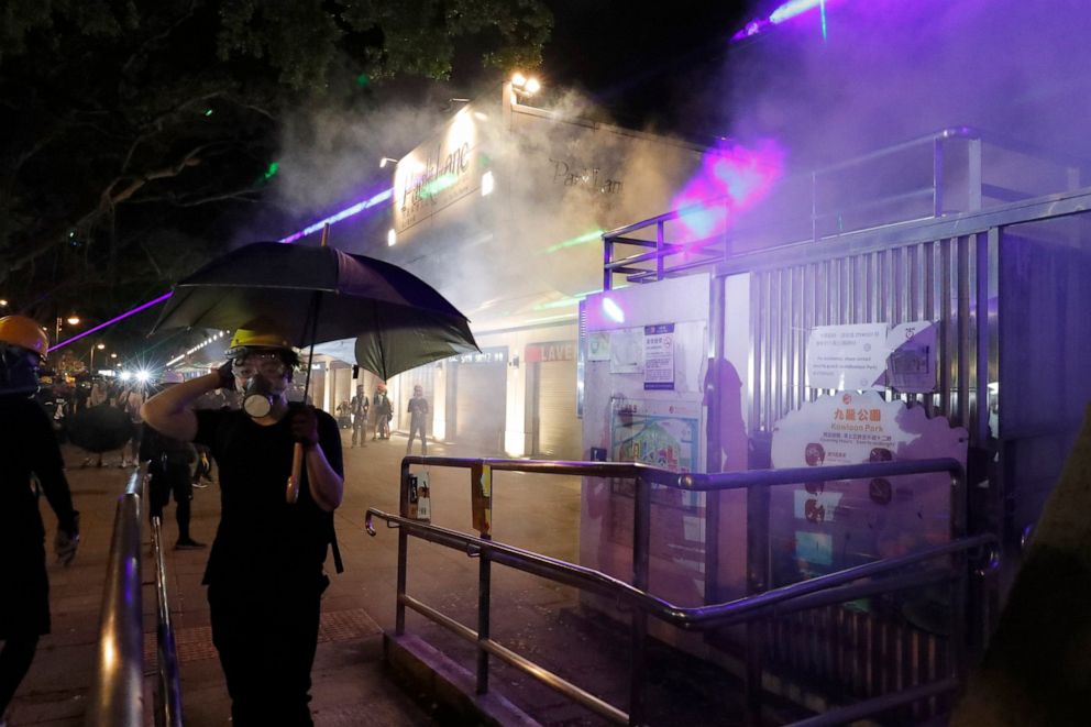 PHOTO: Protesters react to tear gas fired near the Tsim Sha Tsui police station in Hong Kong on Saturday, Aug. 10, 2019. 