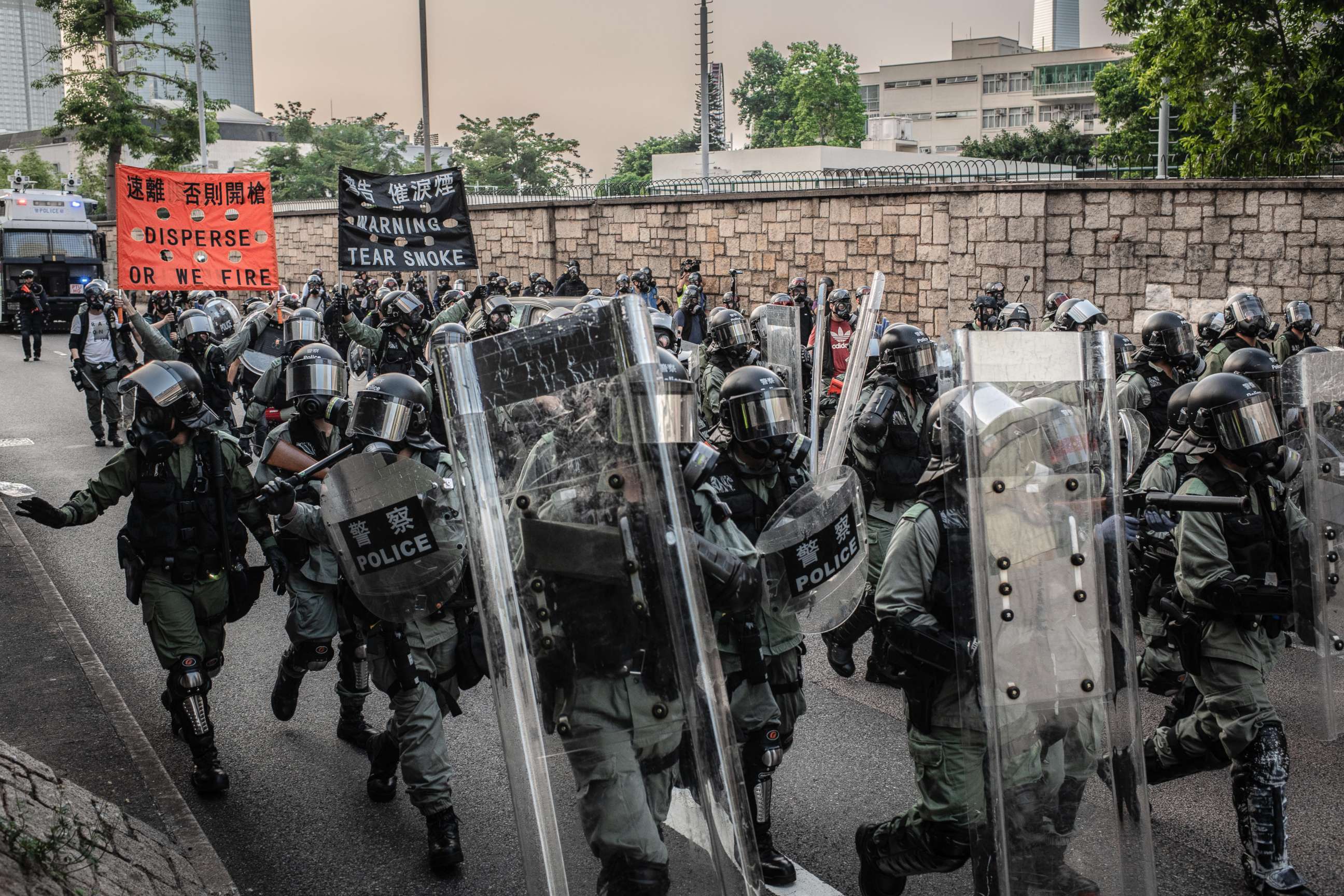 PHOTO: Riot police agents march to clear the surroundings of Legco during a pro-democracy protest in Hong Kong, Sep 15, 2019.