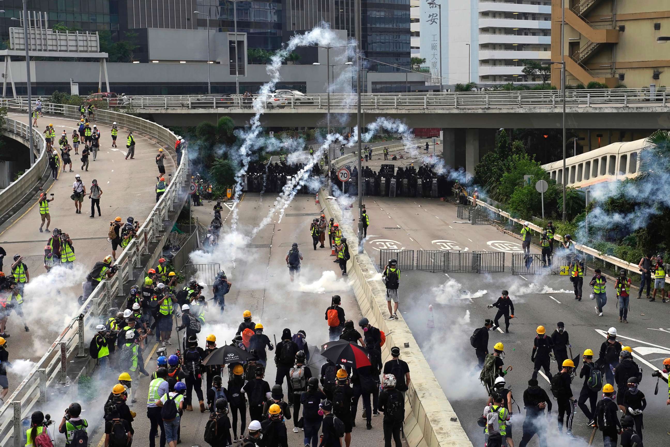PHOTO: Clouds of smoke rise from tear gas canisters as police and demonstrators clash during a protest in Hong Kong, Saturday, Aug. 24, 2019.
