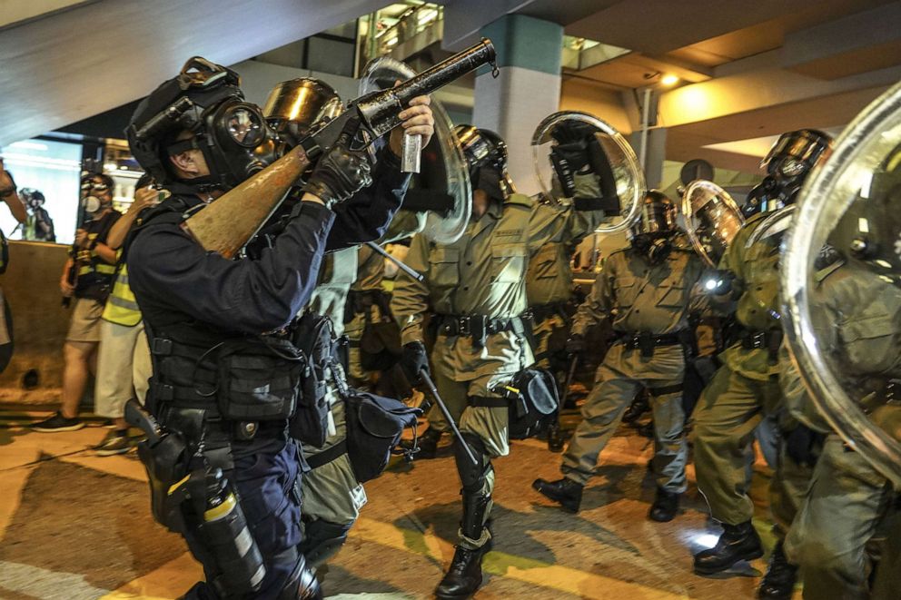 PHOTO: A riot police officer points tear gas gun to a foot bridge when confronting protestors in Hong Kong, Sept. 6, 2019.