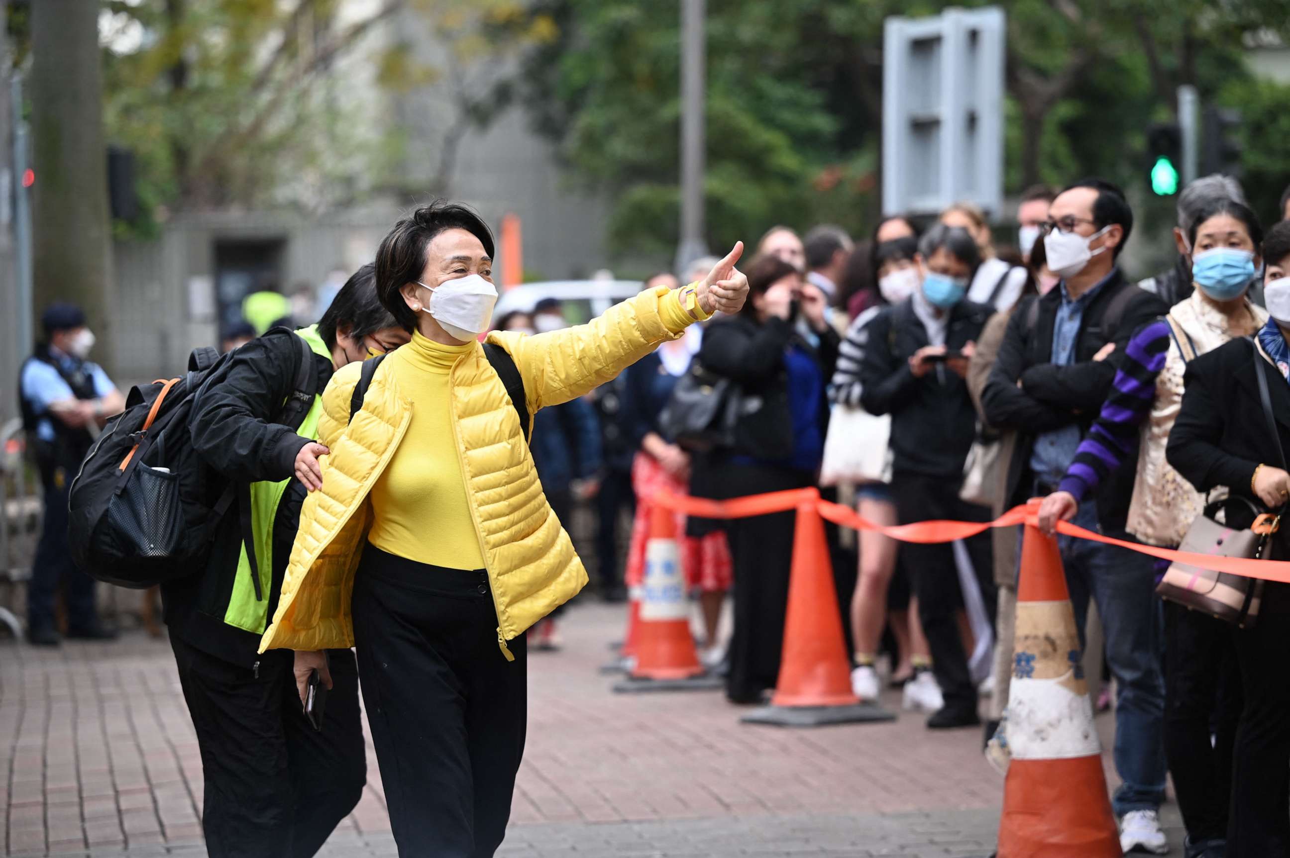 PHOTO: Former Democratic Party chairperson and legislator Emily Lau waves to supporters as she arrives to court in Hong Kong on Feb. 6, 2023, as the trial of 47 of Hong Kong's most prominent pro-democracy figures begins.