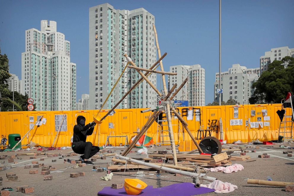 PHOTO: A protester tests a homemade slingshot near Hong Kong Baptist University in Hong Kong, Nov. 15, 2019.