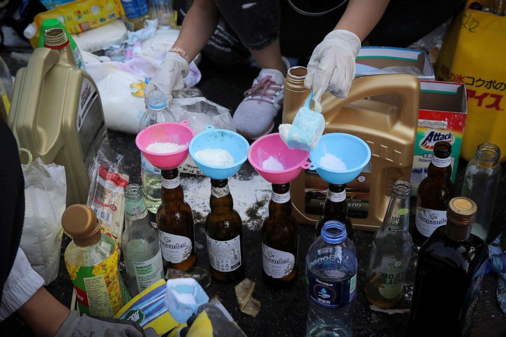 PHOTO: Students make molotov cocktails at the Chinese University in Hong Kong, Nov. 13, 2019.