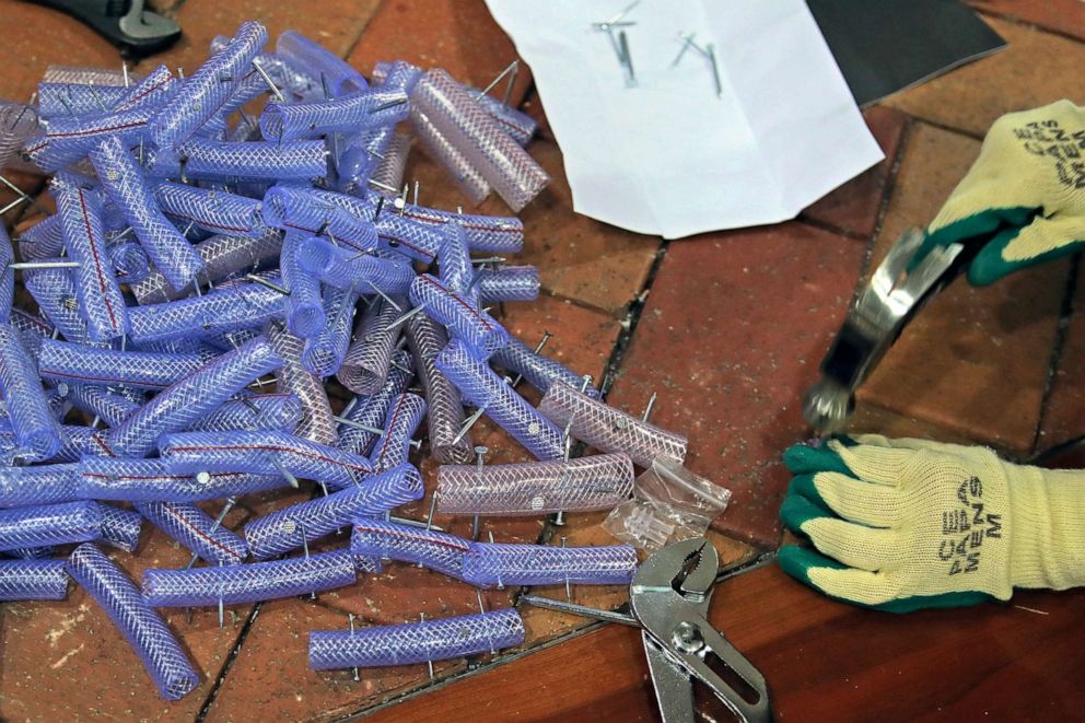 PHOTO: A pro-democracy activist makes nail roadblocks inside the campus of the University of Hong Kong, Nov. 14, 2019.