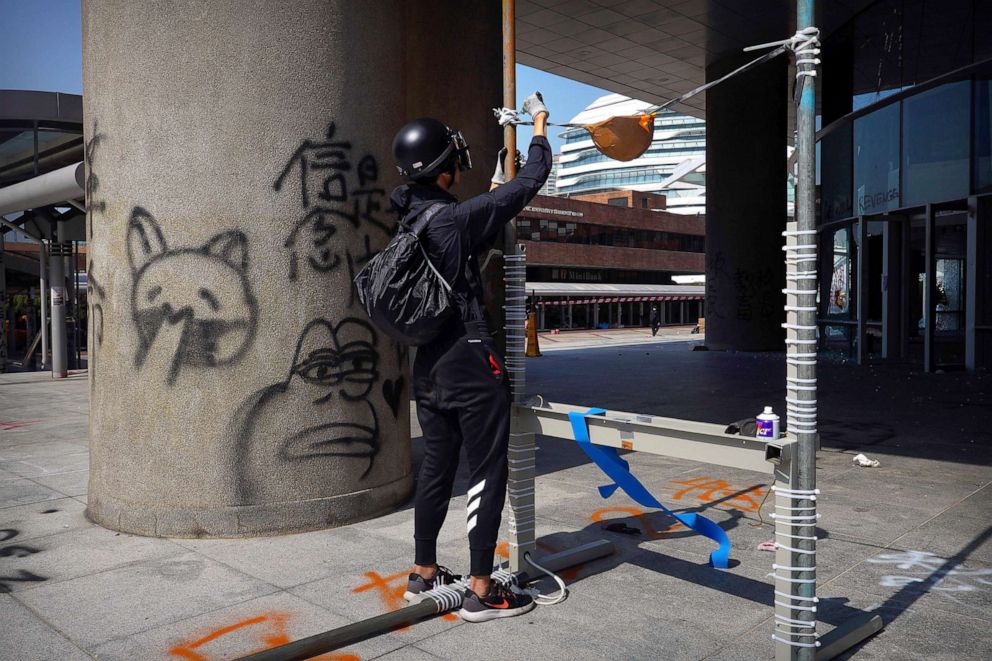 PHOTO: A protester works on a homemade slingshot at Hong Kong Polytechnic University in Hong Kong, Nov. 15, 2019.