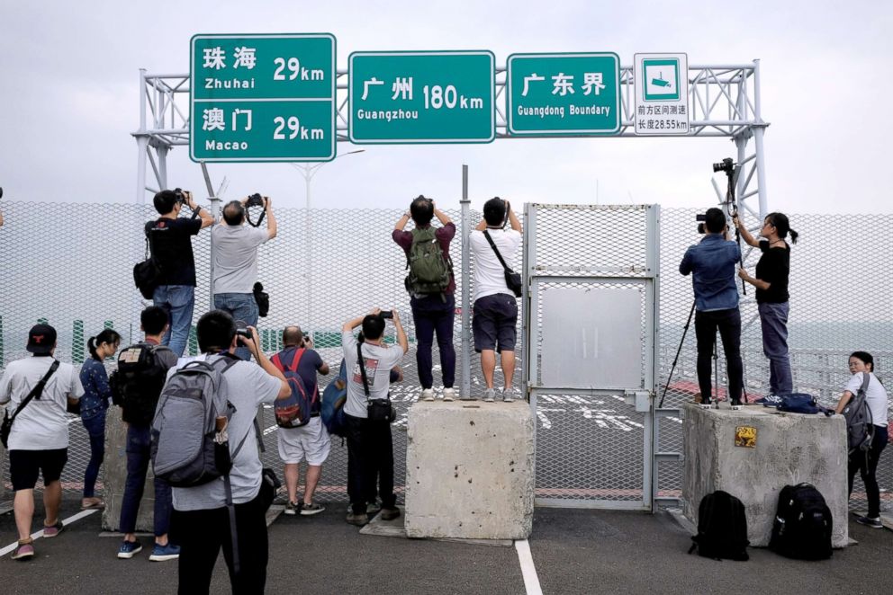 PHOTO: Members of the media take pictures on the Hong Kong side of the Hong Kong-Zhuhai-Macau bridge, Oct. 19, 2018, days before its opening ceremony.