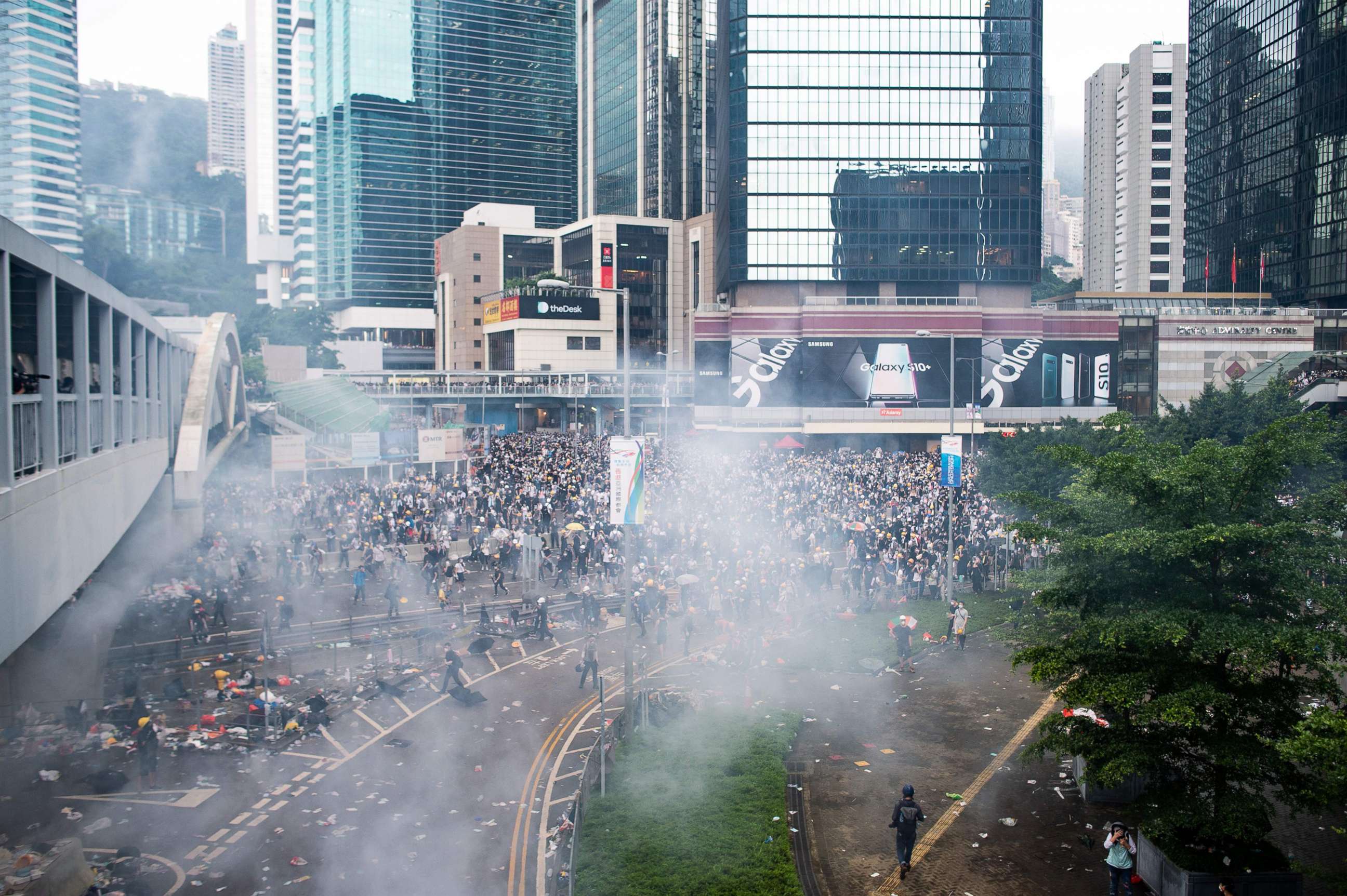 PHOTO: Tear gas is seen outside the Legislative Council during violent clashes between police and protesters rallying against a controversial extradition law proposal outside the government headquarters in Hong Kong, June 12, 2019.