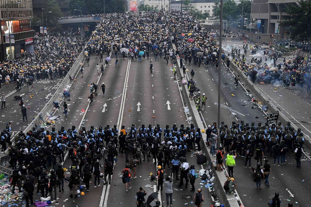 PHOTO: Protesters face off with police after they fired tear gas during a rally against a controversial extradition law proposal outside the government headquarters in Hong Kong, June 12, 2019.