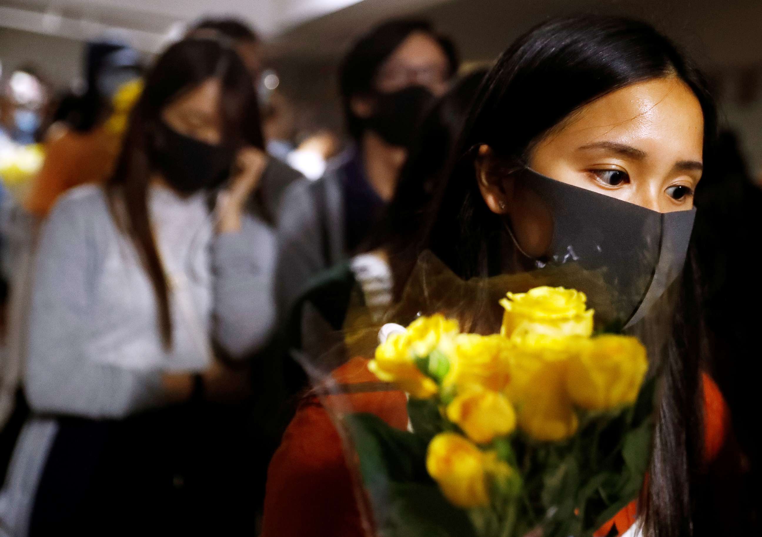 PHOTO:A woman pays tribute with flowers to Chow Tsz-lok in Hong Kong, China, Nov. 8, 2019. 