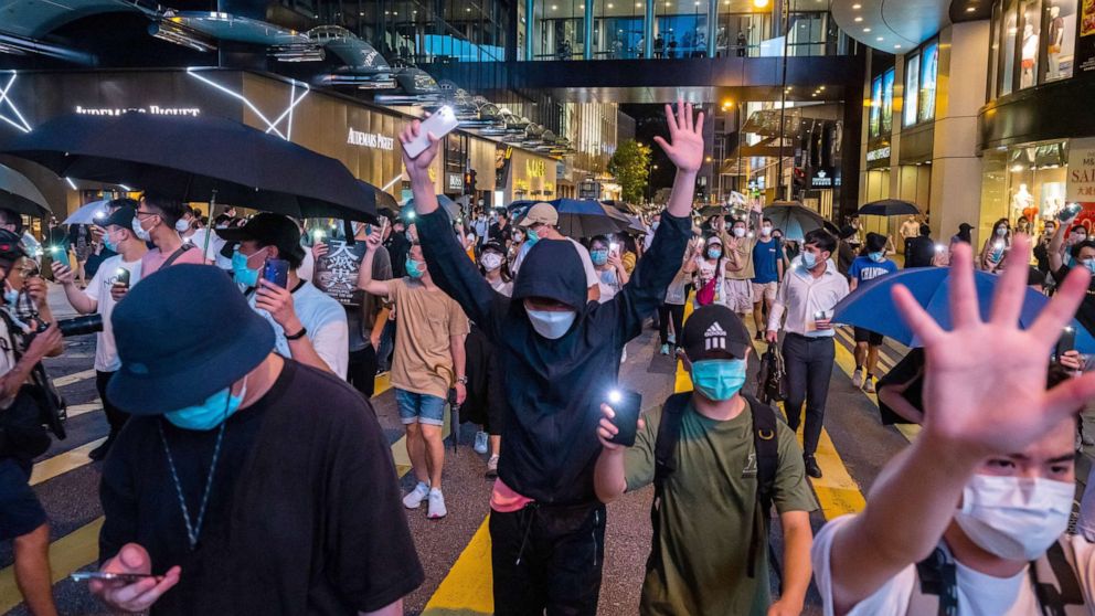 PHOTO: Pro-democracy protesters march in the Central district of Hong Kong, June 9, 2020. The city marked the one-year anniversary since pro-democracy protests erupted following opposition to a bill allowing extraditions to mainland China.