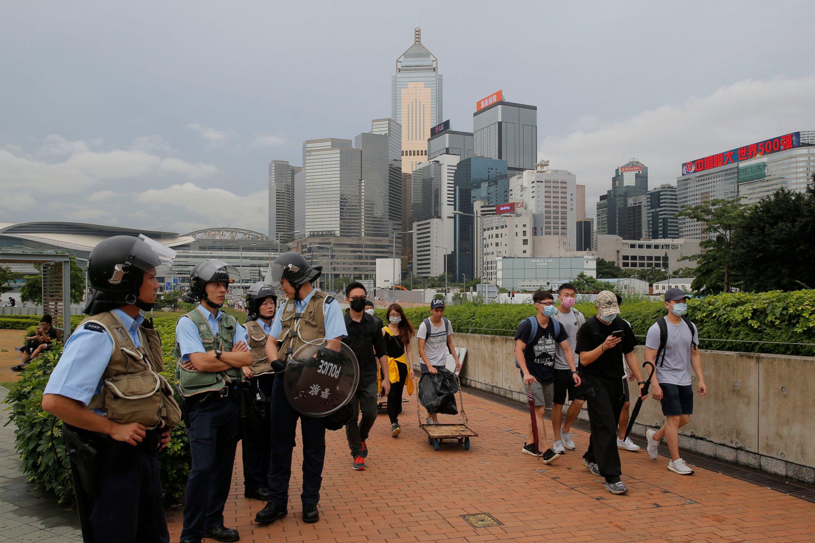 PHOTO: Riot police stand guard as protesters walk outside the Legislative Council in Hong Kong, Thursday, June 13, 2019.