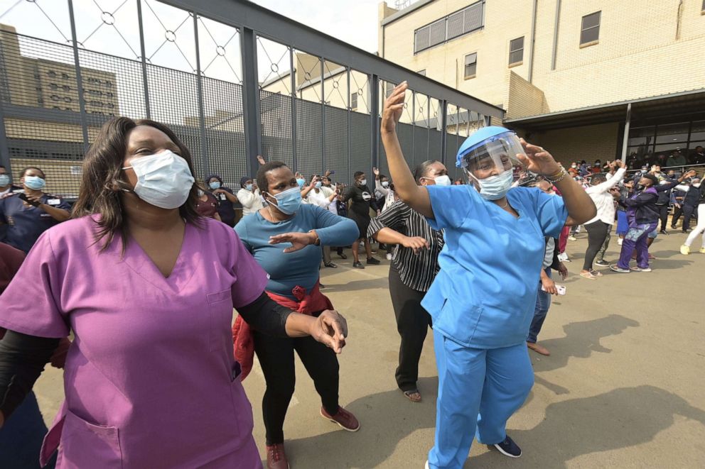 PHOTO: Staff and patients gather at the Chris Hani Baragwanath Hospital listening to songs performed by well-known South African stage personalities in Soweto, on the southwestern outskirts of Johannesburg, on Sept. 22, 2020.