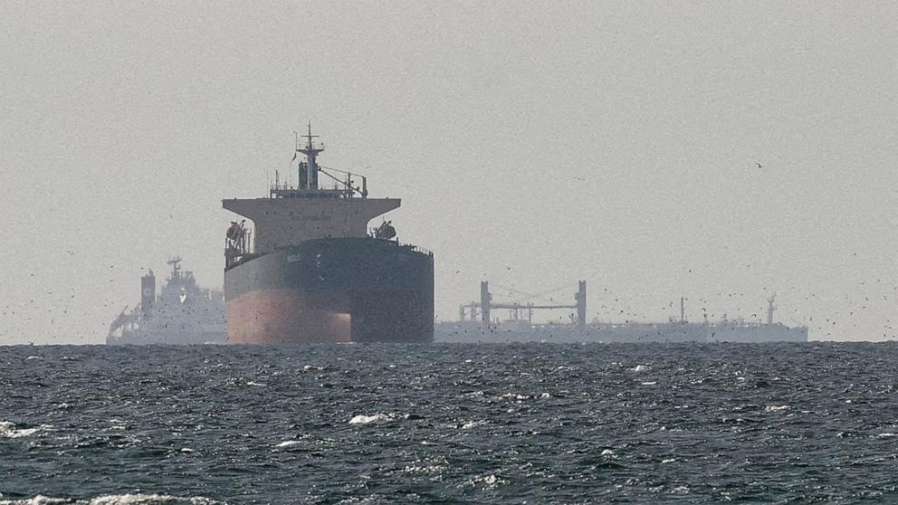 PHOTO: Cargo ships in the Gulf, near the Strait of Hormuz, as seen from northern Ras al-Khaimah, near the border with Oman's Musandam governance, amid the U.S.-Israeli conflict with Iran, in United Arab Emirates, March 11, 2026.