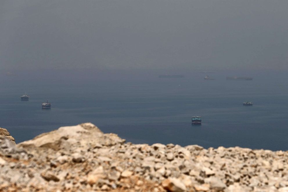 PHOTO: Traditional Omani boats and cargo ships are seen sailing towards the Strait of Hormuz, off the coast of Oman, July 21, 2018. 