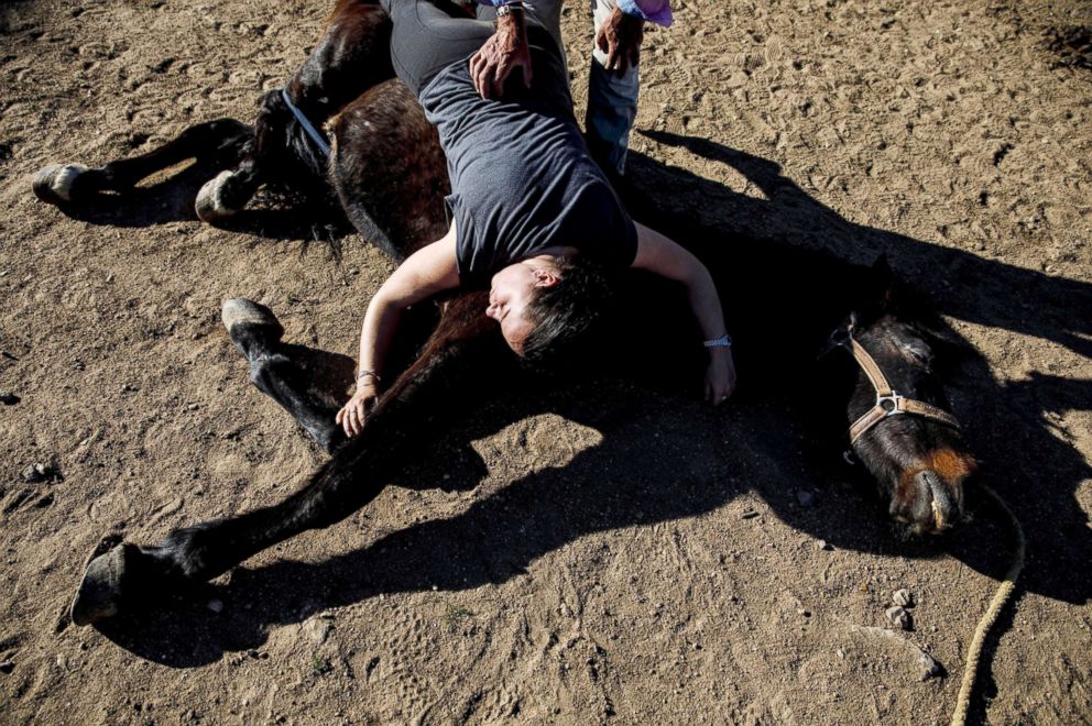 PHOTO: Fernando Noailles, emotional therapist, and his patient Maria Lopez Herraiz attend an emotional therapy session with a horse named Madrid in Guadalix de la Sierra, Spain, April 27, 2018.