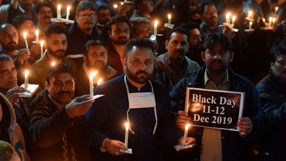 PHOTO: Paramedic staff members participate in a candlelight vigil for the victims who lost their lives during an attack on Dec. 11 by a group of lawyers on Punjab Institute of Cardiology  in Lahore, Dec. 13, 2019.
