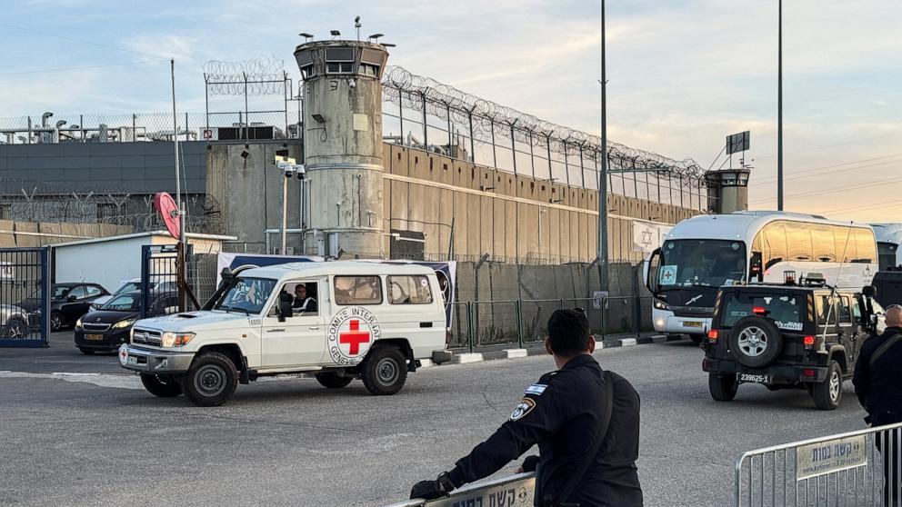 PHOTO: An Israeli police officer looks on as a Red Cross vehicle is seen near the Israeli military prison, Ofer, on the day Israel releases Palestinian prisoners near Ramallah in the Israeli-occupied West Bank, Jan. 19, 2025. 