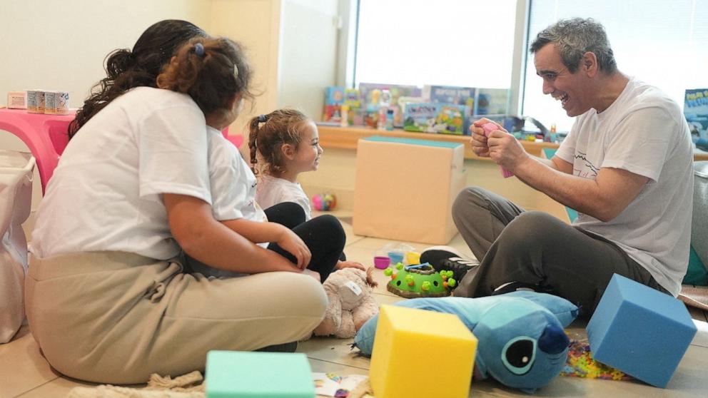 PHOTO: Released Israeli hostage, Omri Miran plays with his daughter, after being released as part of a prisoner-hostage swap and a ceasefire deal between Israel and Hamas, at Sourasky Medical Center in Tel Aviv, Israel October 13, 2025. 