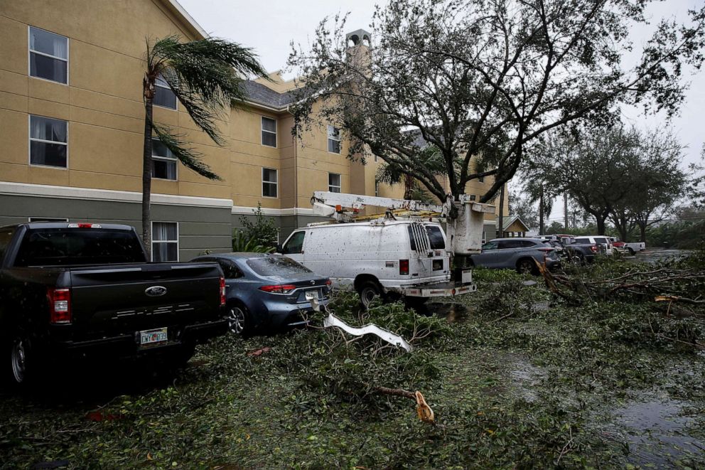 PHOTO: Fallen trees and debris are seen in a parking lot as Hurricane Ian makes landfall in Fort Myers, Fla., Sept. 28, 2022.