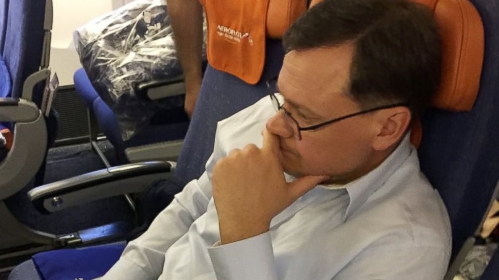 A man identified as convicted Russian spy Evgeny Buryakov is pictured on a commercial flight during his repatriation into the custody of Russian authorities in a photo released on April 5, 2017.